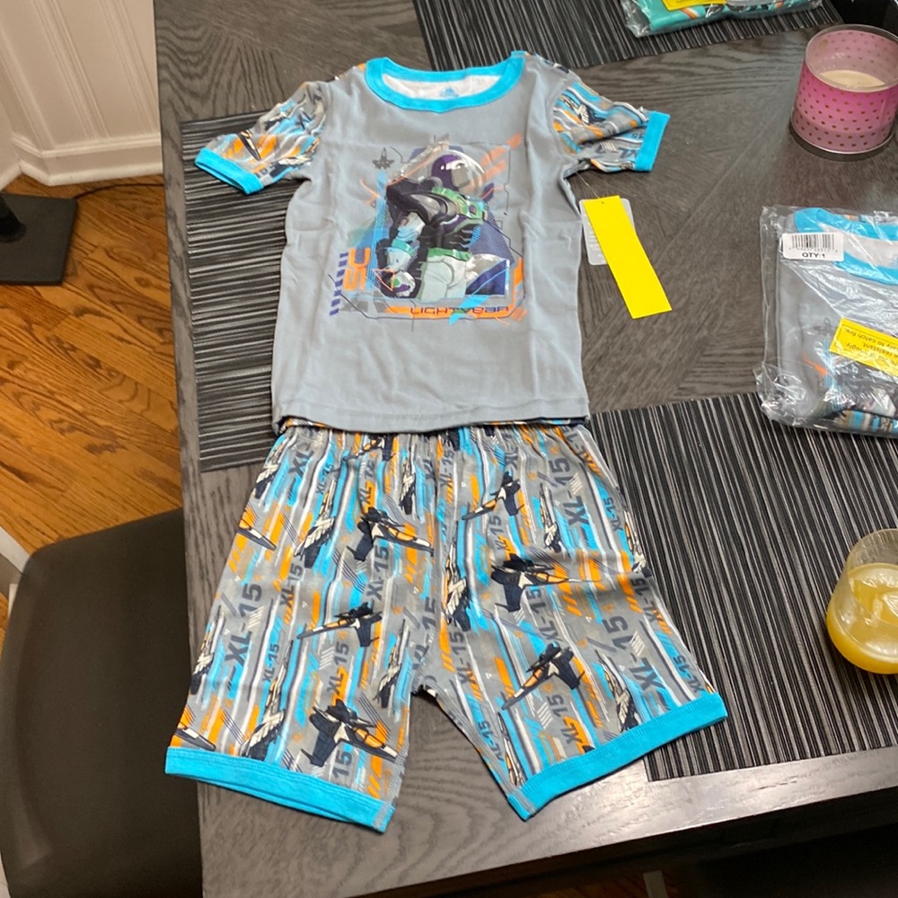 Disney Buzz Lightyear PJ set sized 10 but fits very snug. More like an 8